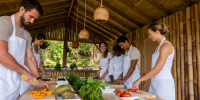 People enjoying a hands-on healthy cooking class preparing fresh ingredients.