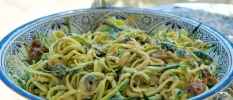 Bowl of pasta with green vegetables in a china bowl
