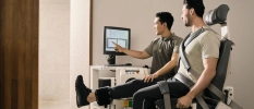 Man is having a body consultation with a wellness specialist checking his findings on a screen