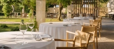 Garden dining terrace with tables dresses for smart evening meal