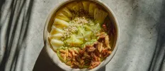 Healthy looking salad bowl with nuts, grains and star-shaped green veg