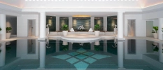 Large indoor pool with small jacuzzi at the back