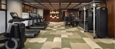 Gym room with various fitness machines and tools 