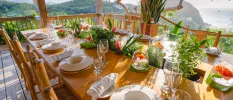 Open-air dining terrace at BodyHoliday St Lucia overlooking tropical hills and Caribbean Sea