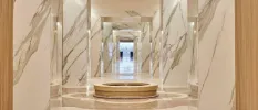Marble walls and pillars with a central water feature 