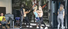 Group of women working out with instructor in a gym