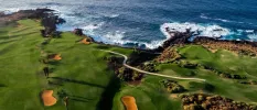 Stunning aerial view of the golf course with sea at distance