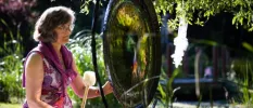 Claudia Roth performing Gong Bath sound healing outdoors