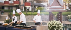 Hotel's chefs cooking healthy food by the pool 