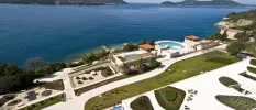 Aerial view of landscapes grounds, with grass lawns and swimming pools overlooking the Adriatic Sea