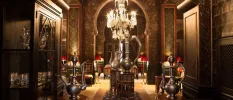 Arabic-style lounge with silver lamps, a chandelier and seating
