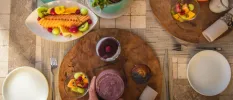 Bowls of fruit on a table laid out for breakfast