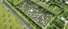 Labyrinth surrounded by manicured grounds in the sunshine  