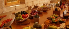Breakfast spread with various items presented on a wooden table