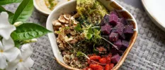 Salad bowl with beetroot, avocado, tomatoes, grains and walnuts