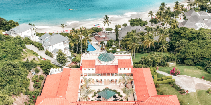 erial view of Body Holiday resort in Saint Lucia, nestled along a white-sand Caribbean beach.