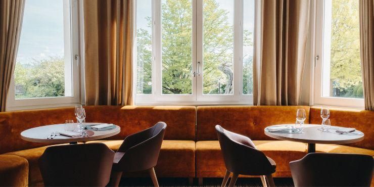 Gourmet food and a glass of white wine on a wooden table